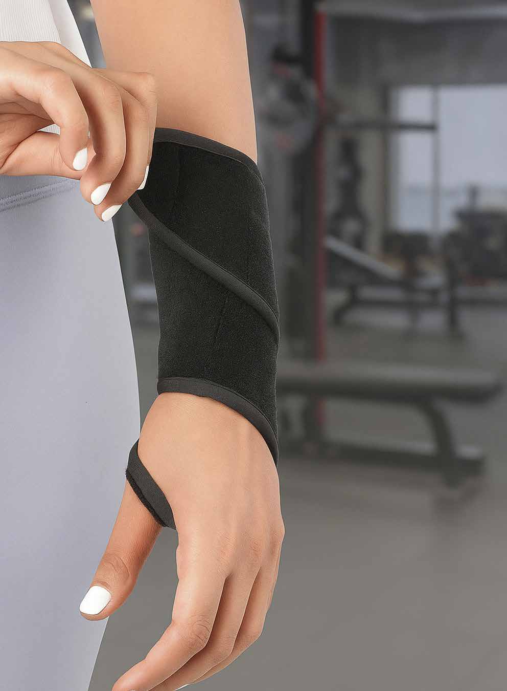 Model pulling on the black neoprene wrist support over the forearm and hand.